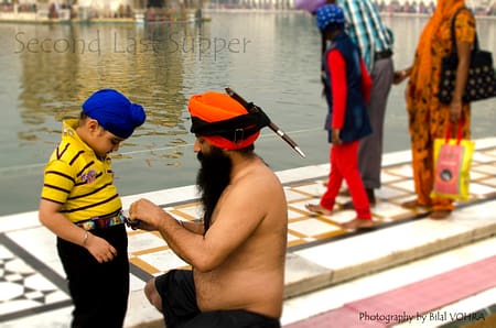 Sikh Man calmly attending his son